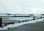 Shemya's Dock At Alcan Harbor, View Towards Wrecked Cool Barge. [George Blood]