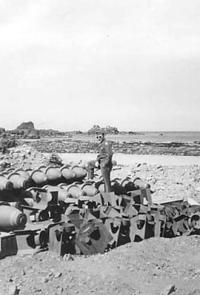 Checking Out Left Over Ordinance On The Beach. [Robert Koppen]